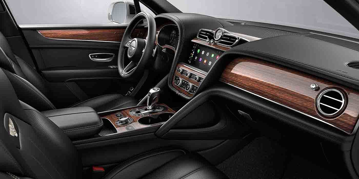 Bentley - Nanchang Bentley Bentayga EWB interior with a Crown Cut Walnut veneer, view from the passenger seat over looking the driver's seat.