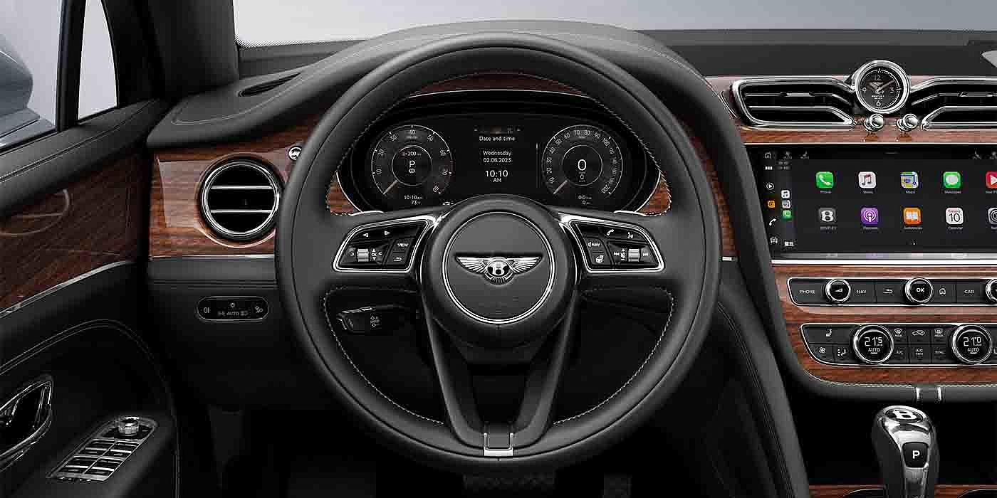 Bentley - Nanchang Bentley Bentayga EWB driver's view - featuring steering wheel in Belgua hide and dashboard with Crown Cut Walnut veneer.